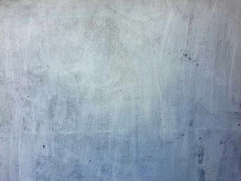 Close-up of a textured gray concrete wall, perfect for background or design use.